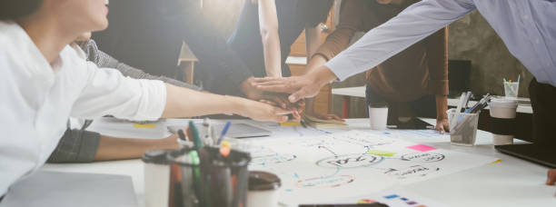 istock Group of team creative business people join hands partnership teamwork concept 1185236146