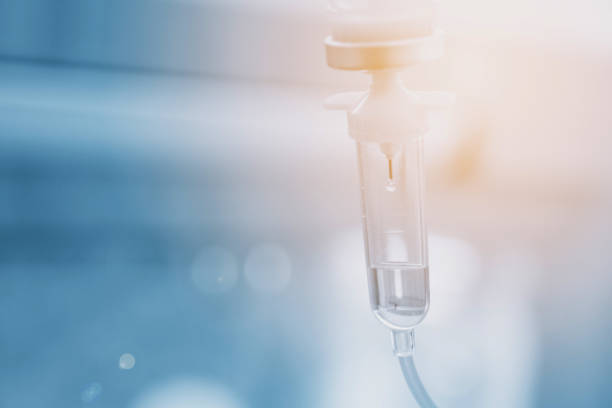 Saline solution drip for treatment patient in the hospital. Saline solution drip for treatment patient in the hospital. infused stock pictures, royalty-free photos & images