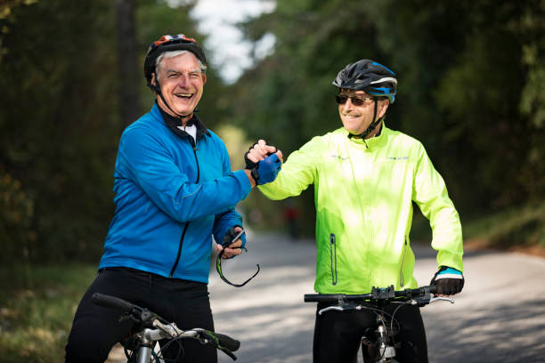 istock Smiling Senior Men Cyclers Congratulating Each Other 1185236470