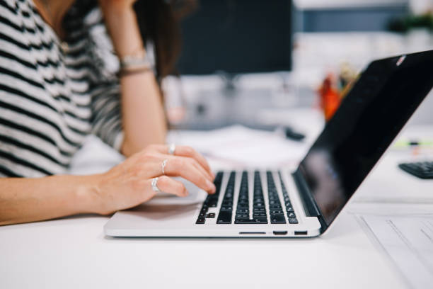istock Close up on woman's hands working on the laptop 1185237217