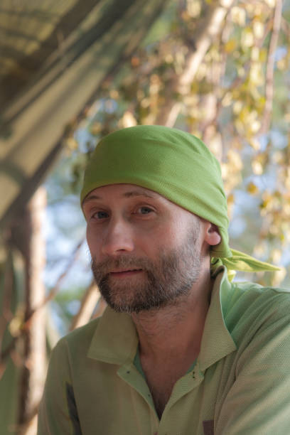 istock man in a green bandana 1185238598