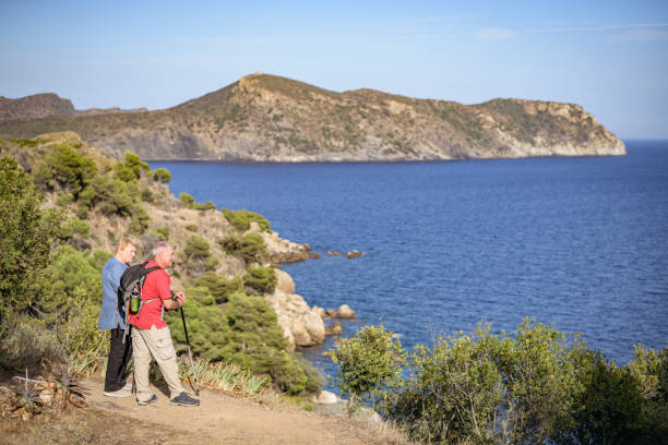 istock Active Spanish seniors enjoying view of Mediterranean 1185239306