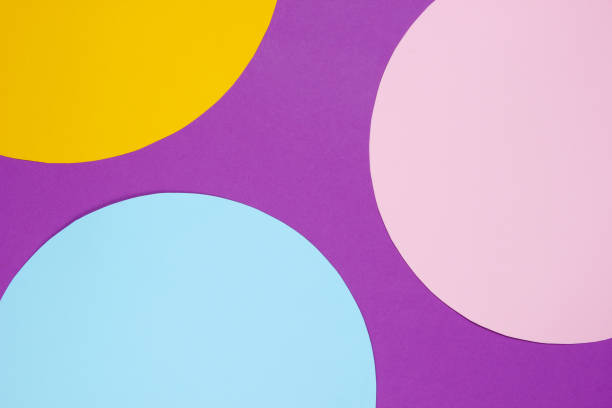 istock Creative magenta background with colored paper circles for copy space 1185240052