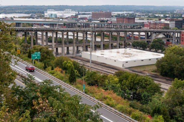 istock City View with Car Traveling on Highway 1185241713