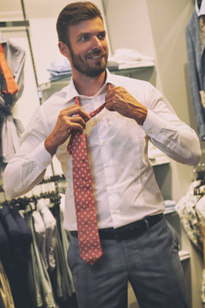 istock Man takes off the tie he tried 1185241935