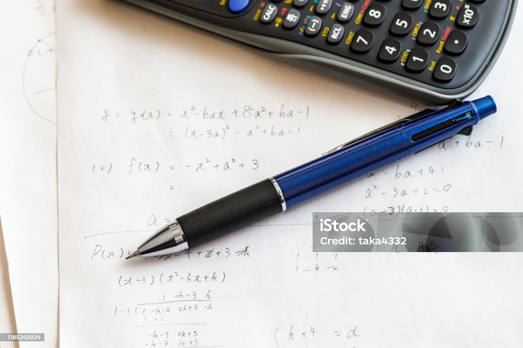 Computing Math With Pen Math Problems And Pen And Calculator Stock Photo - Download Image Now ...