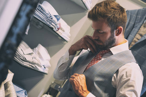 istock Young handsome man choosing ties, choosing neckties 1185242048