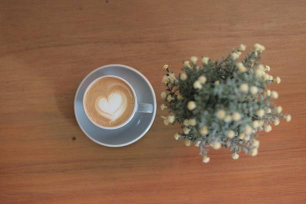 istock A coffee and vase on the table 1185243689