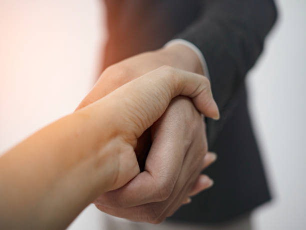 istock close up of businessman shaking hand 1185245038