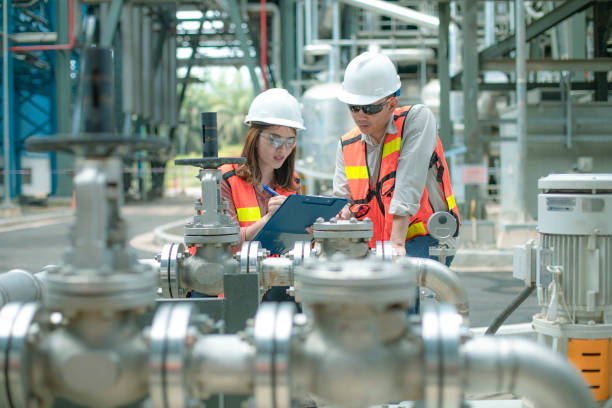 istock electricity engineer and his supervisor at industrial facility 1185245418