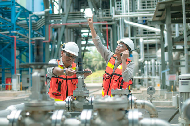 istock electricity engineer and his supervisor at industrial facility 1185246174