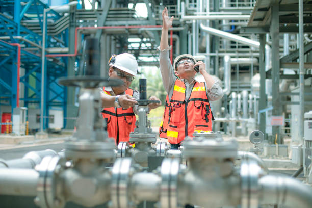 istock electricity engineer and his supervisor at industrial facility 1185246399