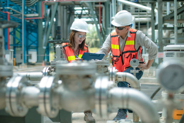 electricity engineer and his supervisor at industrial facility