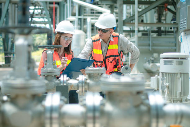 istock electricity engineer and his supervisor at industrial facility 1185246666