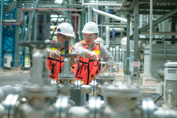 electricity engineer and his supervisor at industrial facility - boiler power station gas boiler industrial boiler imagens e fotografias de stock