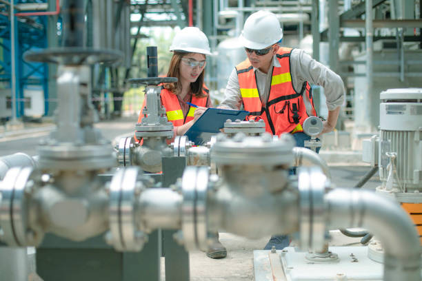 electricity engineer and his supervisor at industrial facility - boiler power station gas boiler industrial boiler imagens e fotografias de stock