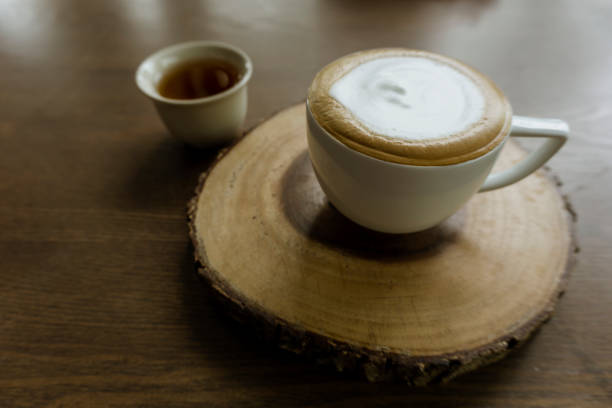 istock A cup of latte coffee on wooden plate 1185247018