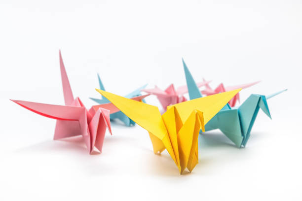 istock Origami birds flock on white background. Leadership concept 1185248189