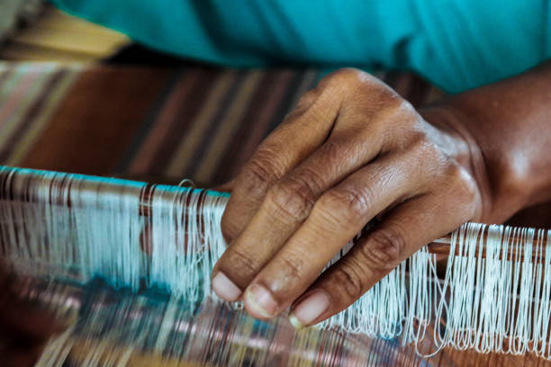 istock Nine Penenun ( TheWeaver Woman ) : Traditional art of weaving 1185249506