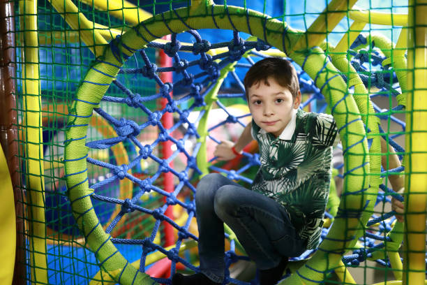 istock Kid in rope maze 1185249586