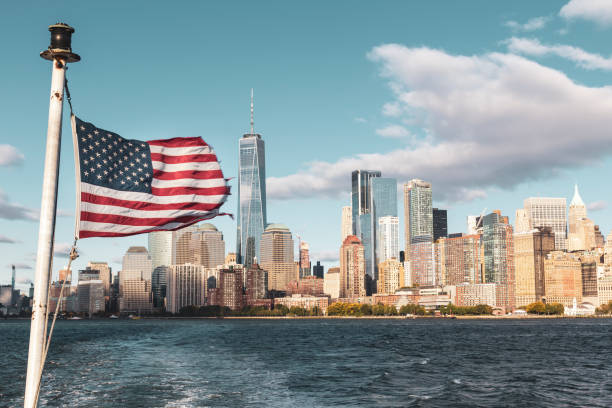 istock New York skyline and american flag 1185250853