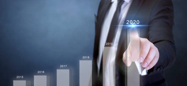 istock 2020 business growth plan. suit businessman touching growth chart 1185250962