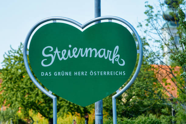 Steiermark, or Styria in Austria. Modern green Traffic warning road sign - heart shape safety construction symbol. Design element. Street blank information concept. Retro Highway. Transportation board