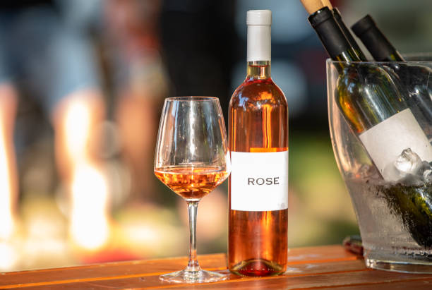 istock Rose wine on a wooden table 1185256862