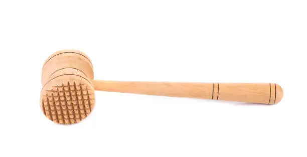 Wooden meat hammer. Isolated in white background. Close-up.