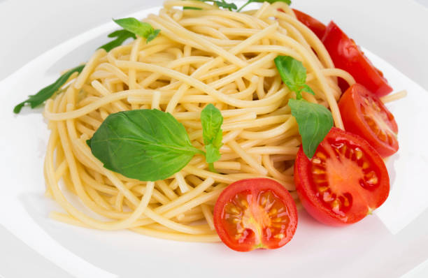 istock Tagliatelli pasta with tomatoes and basil. 1185258867