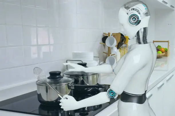 Photo of cooking robot artificial intelligence to cook food in futuristic concept