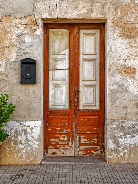 istock old wooden door in the wall 1185259128