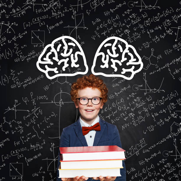 istock Learning science concept. Happy smart child student on blackboard background 1185259249