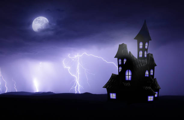 istock Halloween scary backgorund with haunted house and lightnings 1185259435