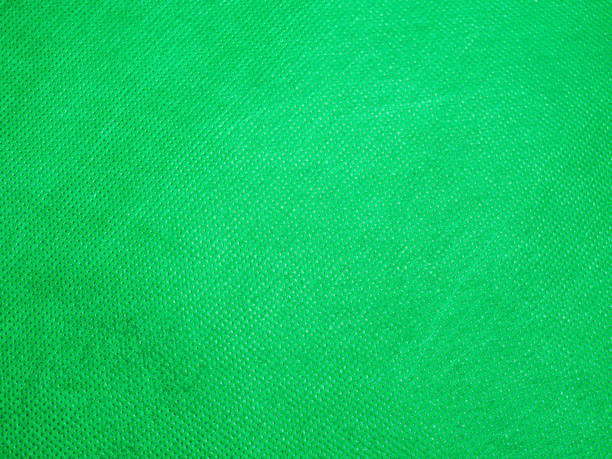 istock Abstract gradient background of rough vivid or vibrant green paper pattern and texture. 1185259503
