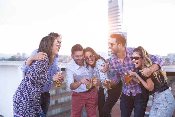 istock Coworkers drinking beer during a relaxing moment in the office 1185260504