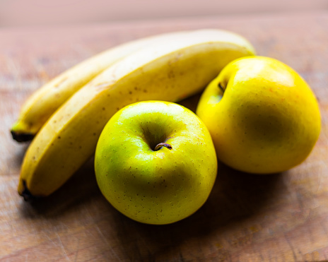 Fresh Fruits on chopping board Healthy Food,Apple with Banana.