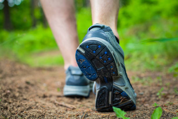 istock Man walking in sport shoes 1185262934