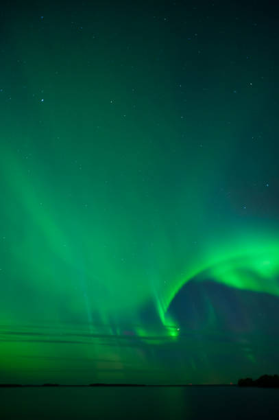 istock Stars and Aurora Borealis above lake 1185264536