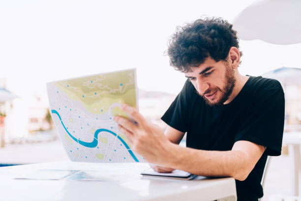 istock Young man planning the vacation 1185265445
