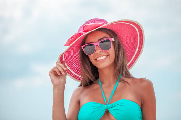 istock Smiling woman in sunhat 1185266248