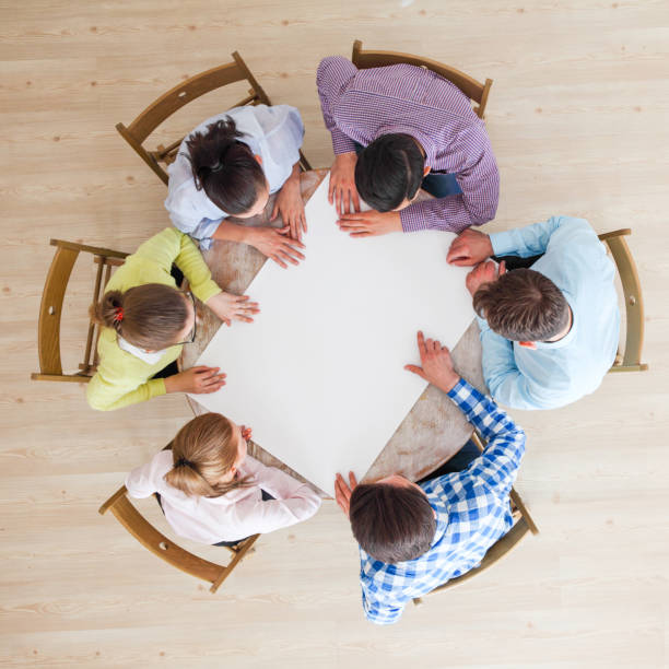 istock People team pointing to white paper 1185266373