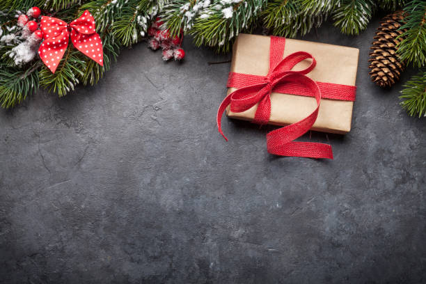 istock Christmas card with decorated fir tree and gift 1185266441