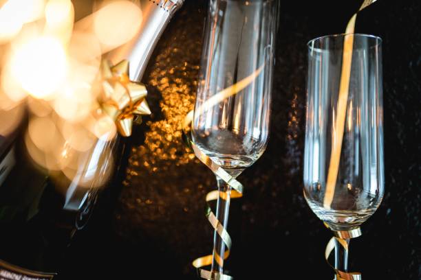 istock champagne glasses with sparkles 1185267026