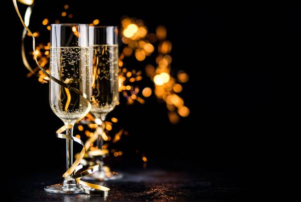 istock champagne glasses with sparkles 1185267119