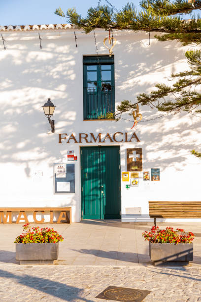 Frigiliana Drugstore or Pharmacy in Spanish The drugstore is located in the Spanish town Frigiliana close to Costa del Sol in Southern Spain. This town is one of the most visited places due to its well kept white houses and streets. The Thursday market attracts numerous visitors. farmacia stock pictures, royalty-free photos & images