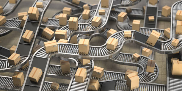 istock Cardboard boxes on conveyor belts and rollers in distribution warehouse, Delivery and packaging service concept background. 1185270953