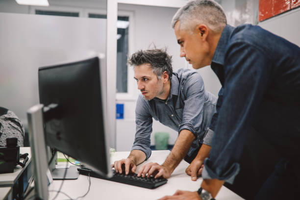 istock Colleagues working together in the office 1185271032