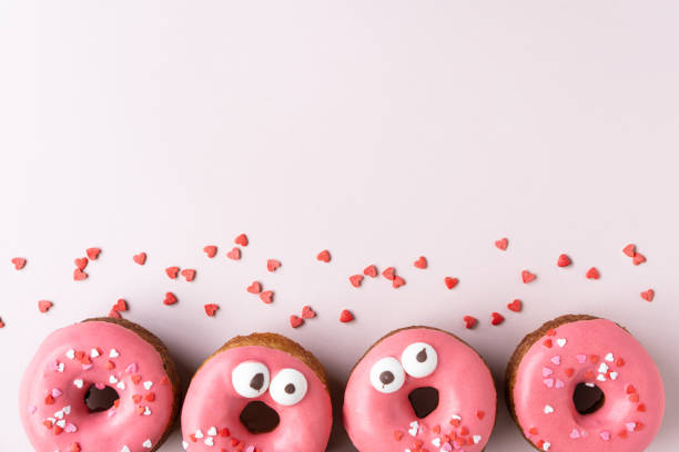 istock Set of various colorful donuts on white background. Top view. 1185272536
