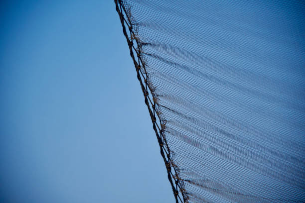 istock Traditional nylon fishnets with blue sky background 1185274141